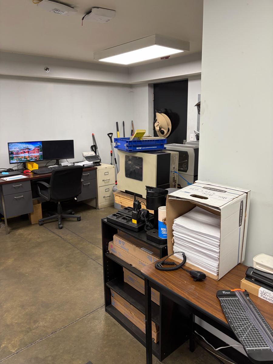 Cleaned plant office with desks and polished concrete floor after janitorial service